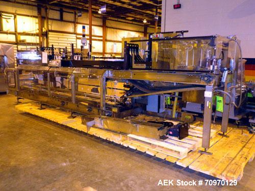 Used- Hartness 900 automatic drop case packer capable of speeds up to 25 cases per minute (depending on product and applicat...