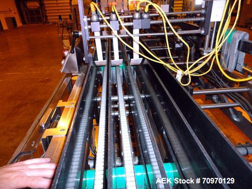 Used Hartness 900 automatic drop case packer capable of speeds up to 25 cases per minute (depending on product and application). Case size range: (Length) 6" to 24" (Width) 6" to 16" (Height) 1-1/2" ...