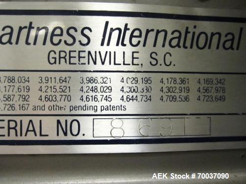 Used Hartness Case Packer with Infeed Laner, Model CP900/825. Servo controlled lowering head drop packer capable of speeds up to 30cpm. Allen Bradley SLC 5/04 PLC with Pacific Scientific servo contro...