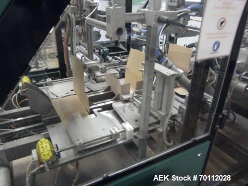 Used Ixapack Case Packer, Model Vendor IX MANU. Speeds up to 60 cases per minute. Last used for aerosol can application, format of aerosols previous packed: 6 x 65mm diameter x 195mm long aerosol can...