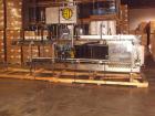 Used Hartness International 825SS drop case packer. Capable of speeds up to 25 CPM. Case size range: length 7