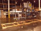 Used Hartness International 825SS drop case packer. Capable of speeds up to 25 CPM. Case size range: length 7