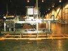 Used Hartness International 825SS drop case packer. Capable of speeds up to 25 CPM. Case size range: length 7