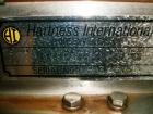 Used Hartness International 825SS drop case packer. Capable of speeds up to 25 CPM. Case size range: length 7