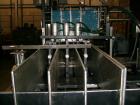 Used Hartness International 825SS drop case packer. Capable of speeds up to 25 CPM. Case size range: length 7