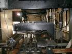 Used Hartness International 825SS drop case packer. Capable of speeds up to 25 CPM. Case size range: length 7