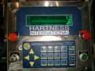 Used Hartness International 825SS drop case packer. Capable of speeds up to 25 CPM. Case size range: length 7