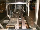 Used Hartness International 825SS drop case packer. Capable of speeds up to 25 CPM. Case size range: length 7