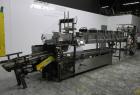 Used Combi Packaging Systems Model DPI Drop Case Packer. Has a model 2LD128 laner option. Capable of speeds up to 28 cases per minute. Has a case size range: (length) 4.5