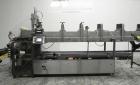 Used Combi Packaging Systems Model DPI Drop Case Packer. Has a model 2LD128 laner option. Capable of speeds up to 28 cases per minute. Has a case size range: (length) 4.5