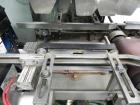 Used Combi Packaging Systems Model DPI Drop Case Packer. Has a model 2LD128 laner option. Capable of speeds up to 28 cases per minute. Has a case size range: (length) 4.5