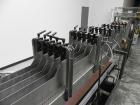 Used Combi Packaging Systems Model DPI Drop Case Packer. Has a model 2LD128 laner option. Capable of speeds up to 28 cases per minute. Has a case size range: (length) 4.5