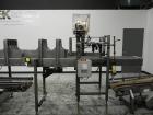Used Combi Packaging Systems Model DPI Drop Case Packer. Has a model 2LD128 laner option. Capable of speeds up to 28 cases per minute. Has a case size range: (length) 4.5
