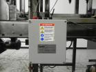 Used Combi Packaging Systems Model DPI Drop Case Packer. Has a model 2LD128 laner option. Capable of speeds up to 28 cases per minute. Has a case size range: (length) 4.5
