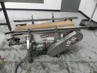Used Combi Packaging Systems Model DPI Drop Case Packer. Has a model 2LD128 laner option. Capable of speeds up to 28 cases per minute. Has a case size range: (length) 4.5