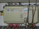 Used Combi Packaging Systems Model DPI Drop Case Packer. Has a model 2LD128 laner option. Capable of speeds up to 28 cases per minute. Has a case size range: (length) 4.5