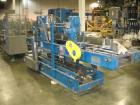 Used Hartness Drop Case Packer, Model 100 RH. Mild steel frame drop casepacker. Includes grid for approximately 0.5L bottle in 4 x 6 pattern. Other grids are available at an additional cost.