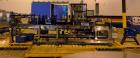 Used Hartness 825-AT automatic stainless steel drop case packer case packer capable of speeds up to 35 cases per minute (depending on product and application). Case size range: (Length) 6