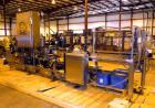 Used Hartness 825-AT automatic stainless steel drop case packer case packer capable of speeds up to 35 cases per minute (depending on product and application). Case size range: (Length) 6