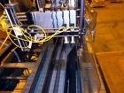 Used- Hartness 825-AT automatic stainless steel drop case packer case packer capable of speeds up to 35 cases per minute (de...