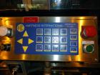 Used- Hartness 825-AT automatic stainless steel drop case packer case packer capable of speeds up to 35 cases per minute (de...