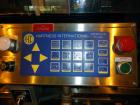 Used Hartness 825-AT automatic stainless steel drop case packer case packer capable of speeds up to 35 cases per minute (depending on product and application). Case size range: (Length) 6