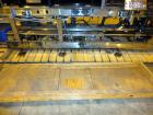 Used Hartness 825-AT automatic stainless steel drop case packer case packer capable of speeds up to 35 cases per minute (depending on product and application). Case size range: (Length) 6
