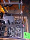 Used Hartness International 825AT Case Packer Change Parts. Consisting Of: 3 skids, 3 carts. 580cc (12pk), 1875cc (6pk.), 850cc (6pk.), 1250cc (6pk.), 1875cc (8pk.), 850cc (12pk.), 5.5 oz. (12pk.), 1...