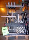 Used Hartness International 825AT Case Packer Change Parts. Consisting Of: 3 skids, 3 carts. 580cc (12pk), 1875cc (6pk.), 850cc (6pk.), 1250cc (6pk.), 1875cc (8pk.), 850cc (12pk.), 5.5 oz. (12pk.), 1...