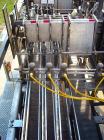 Used Hartness Model 825 Fully Auto Case Packer with all stainless steel frame.Unit has been recently upgraded from factory with Parker drives for auto-laner.Panel is complete with AB 503 PLC controll...