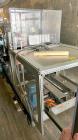 Used-Hartness Model 835 Automatic Descending Drop Case Packer