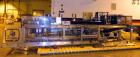 Used- Hartness 900 automatic drop case packer capable of speeds up to 25 cases per minute (depending on product and applicat...