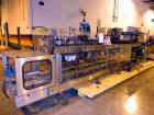 Used Hartness 900 automatic drop case packer capable of speeds up to 25 cases per minute (depending on product and application). Case size range: (Length) 6