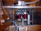 Used Hartness 900 automatic drop case packer capable of speeds up to 25 cases per minute (depending on product and application). Case size range: (Length) 6
