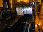 Used- Hartness 900 automatic drop case packer capable of speeds up to 25 cases per minute (depending on product and applicat...