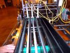 Used Hartness 900 automatic drop case packer capable of speeds up to 25 cases per minute (depending on product and application). Case size range: (Length) 6