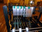 Used Hartness 900 automatic drop case packer capable of speeds up to 25 cases per minute (depending on product and application). Case size range: (Length) 6