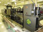 Used Hartness Case Packer with Infeed Laner, Model CP900/825. Servo controlled lowering head drop packer capable of speeds up to 30cpm. Allen Bradley SLC 5/04 PLC with Pacific Scientific servo contro...