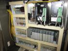 Used Hartness Case Packer with Infeed Laner, Model CP900/825. Servo controlled lowering head drop packer capable of speeds up to 30cpm. Allen Bradley SLC 5/04 PLC with Pacific Scientific servo contro...
