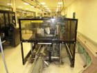 Used Hartness Case Packer with Infeed Laner, Model CP900/825. Servo controlled lowering head drop packer capable of speeds up to 30cpm. Allen Bradley SLC 5/04 PLC with Pacific Scientific servo contro...
