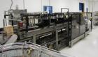 Used Hartness Case Packer with Infeed Laner, Model CP900/825. Servo controlled lowering head drop packer capable of speeds up to 30cpm. Allen Bradley SLC 5/04 PLC with Pacific Scientific servo contro...