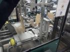 Used Ixapack Case Packer, Model Vendor IX MANU. Speeds up to 60 cases per minute. Last used for aerosol can application, format of aerosols previous packed: 6 x 65mm diameter x 195mm long aerosol can...