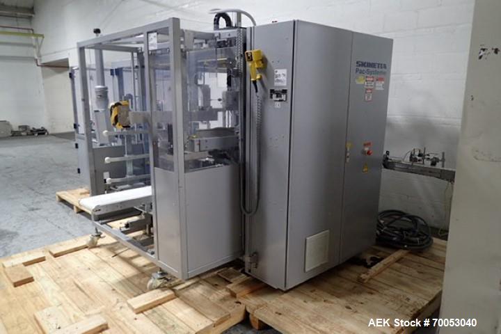 Used Skinetta Top Loading Case Erector Packer, Model CP 150. Servo driven loading head, with powered case feeder and case erector. Integrated top and bottom case taper. Includes controls. 3/60/480 Vo...