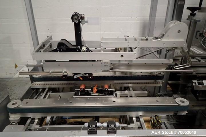 Used Skinetta Top Loading Case Erector Packer, Model CP 150. Servo driven loading head, with powered case feeder and case erector. Integrated top and bottom case taper. Includes controls. 3/60/480 Vo...