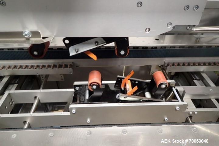 Used Skinetta Top Loading Case Erector Packer, Model CP 150. Servo driven loading head, with powered case feeder and case erector. Integrated top and bottom case taper. Includes controls. 3/60/480 Vo...