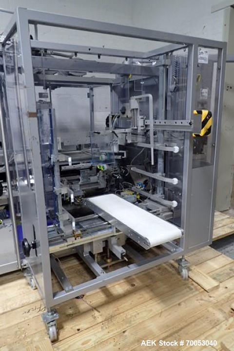 Used Skinetta Top Loading Case Erector Packer, Model CP 150. Servo driven loading head, with powered case feeder and case erector. Integrated top and bottom case taper. Includes controls. 3/60/480 Vo...