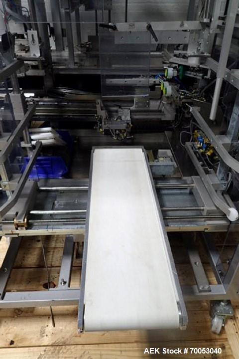 Used Skinetta Top Loading Case Erector Packer, Model CP 150. Servo driven loading head, with powered case feeder and case erector. Integrated top and bottom case taper. Includes controls. 3/60/480 Vo...
