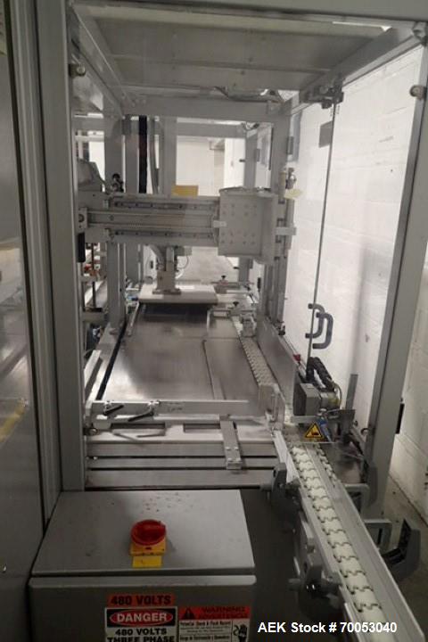 Used Skinetta Top Loading Case Erector Packer, Model CP 150. Servo driven loading head, with powered case feeder and case erector. Integrated top and bottom case taper. Includes controls. 3/60/480 Vo...