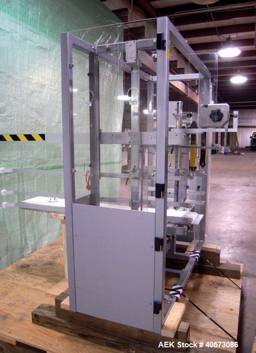 Used Skinetta CP150 Automatic Top Load Robotic Case Erector, Packer And Sealer. Has AB PLC controls, tape seal system and was last running bundles into top load case. Packer Erector / Sealer CP 150. ...