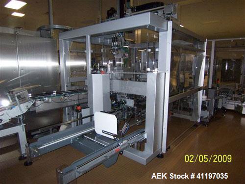 Used Cermex Sidel model SD59 top loading case packer capable of speeds up to 28 case per minute. Has automatic collation, AB PLC controls, tape seal system.